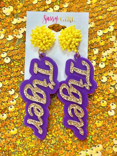 Acrylic gold glitter tiger word with purple background and Pom